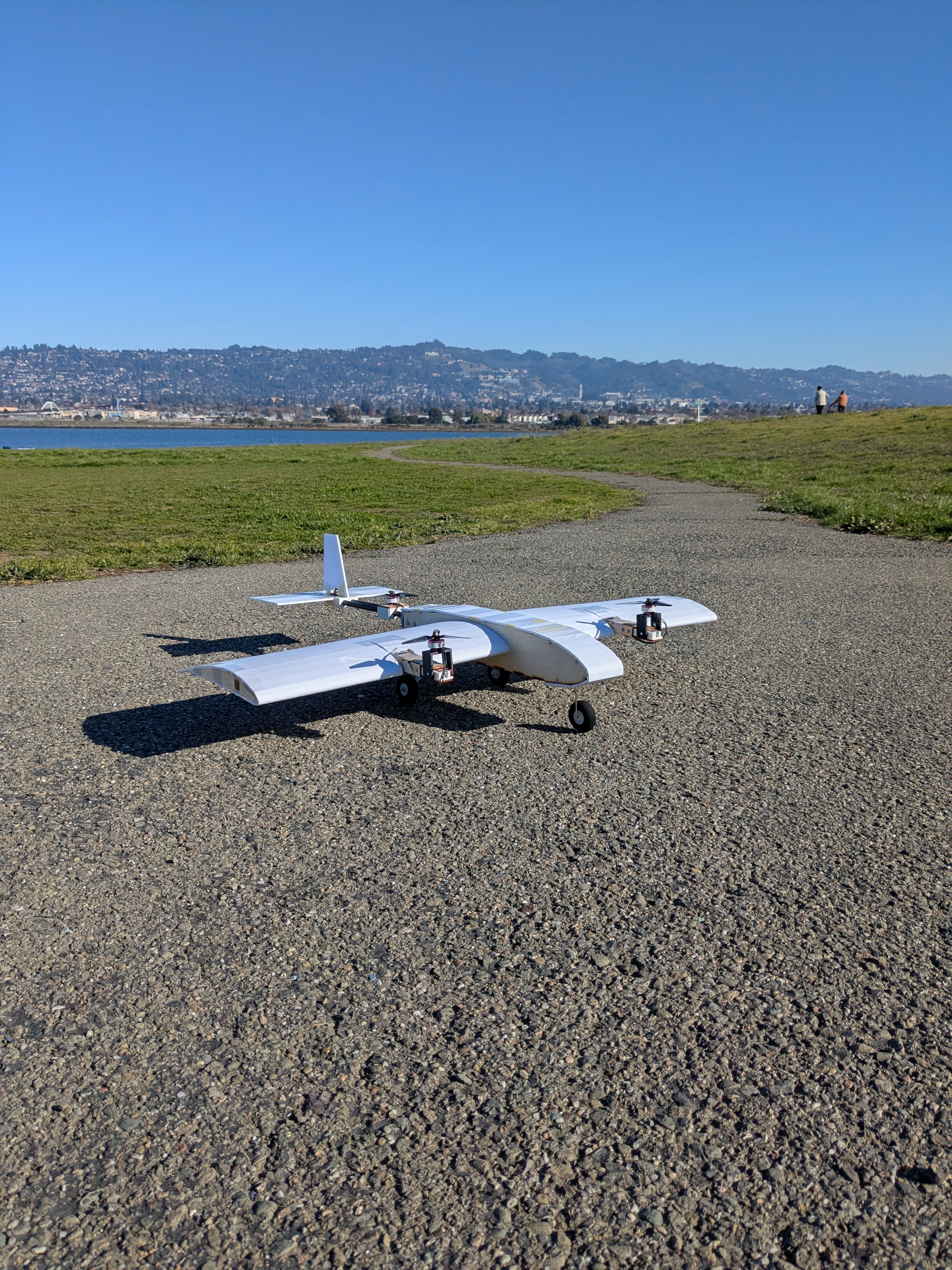 Assembled foam-covered tilt-rotor aircraft with three propellers and landing gear